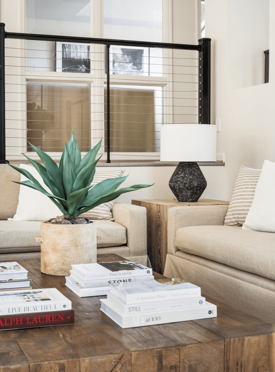 a living room filled with furniture and a large plant at Bridges at Mallard Creek Apartment Homes, Charlotte, 28269