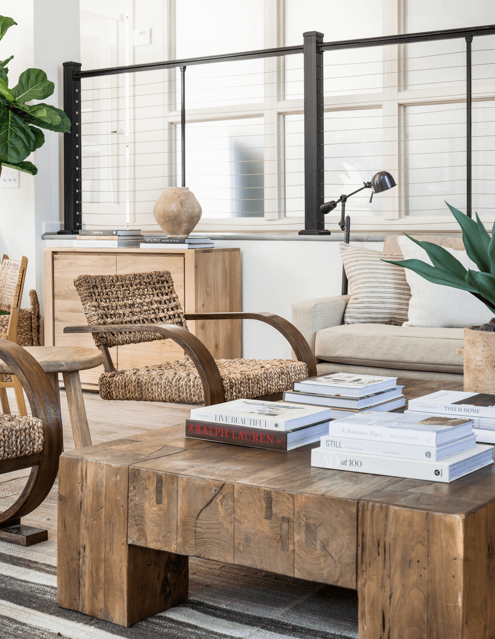 a living room filled with furniture and a large window at Bridges at Mallard Creek Apartment Homes, Charlotte