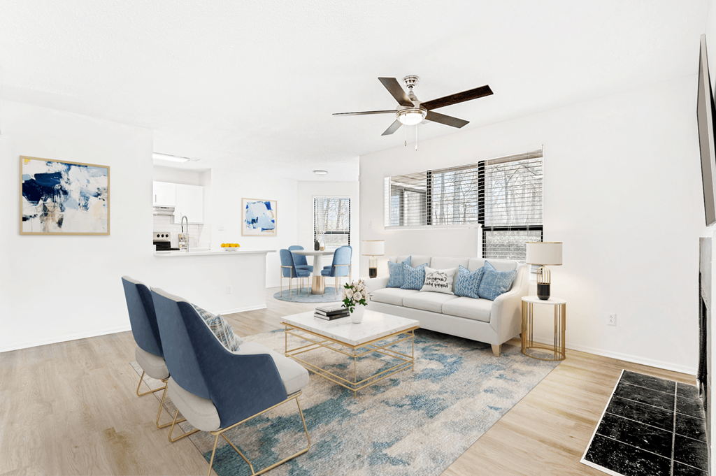Living Room With Ceiling Fan at Bridges at Mallard Creek Apartment Homes, North Carolina