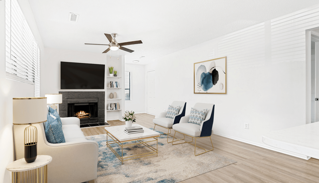 a living room with white walls and a fireplace  at Bridges at Mallard Creek Apartment Homes, Charlotte, 28269