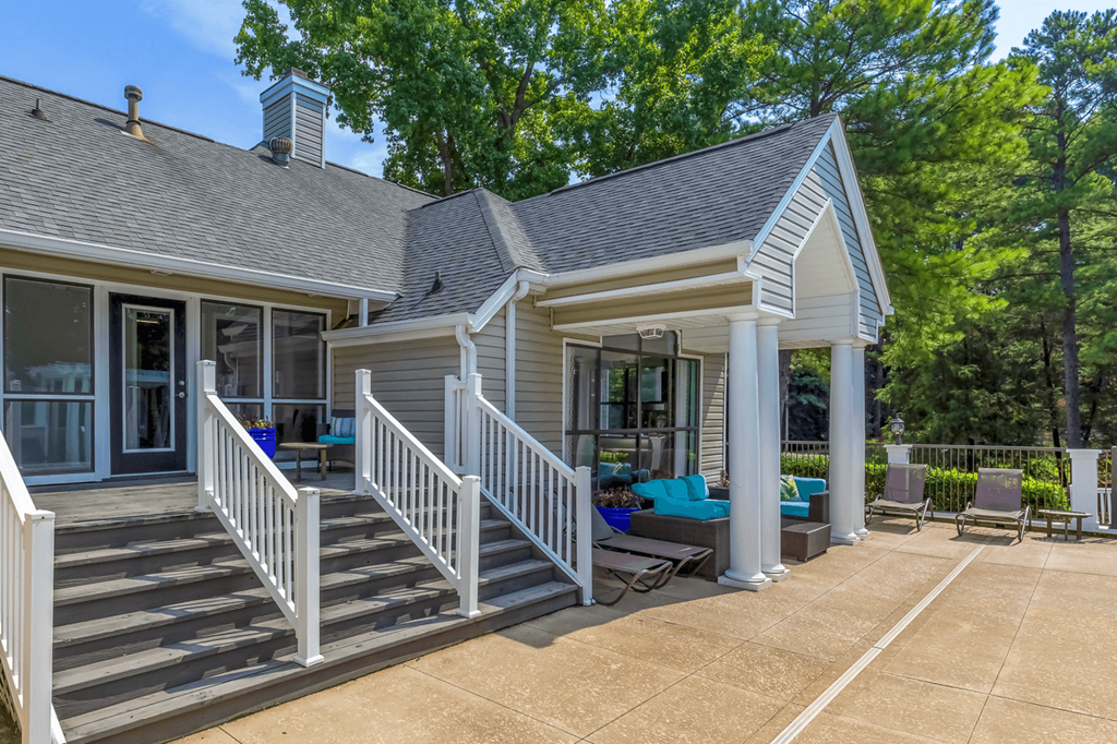 a house with a porch and stairs leading up to it at Bridges at Mallard Creek Apartment Homes, Charlotte, NC, 28269