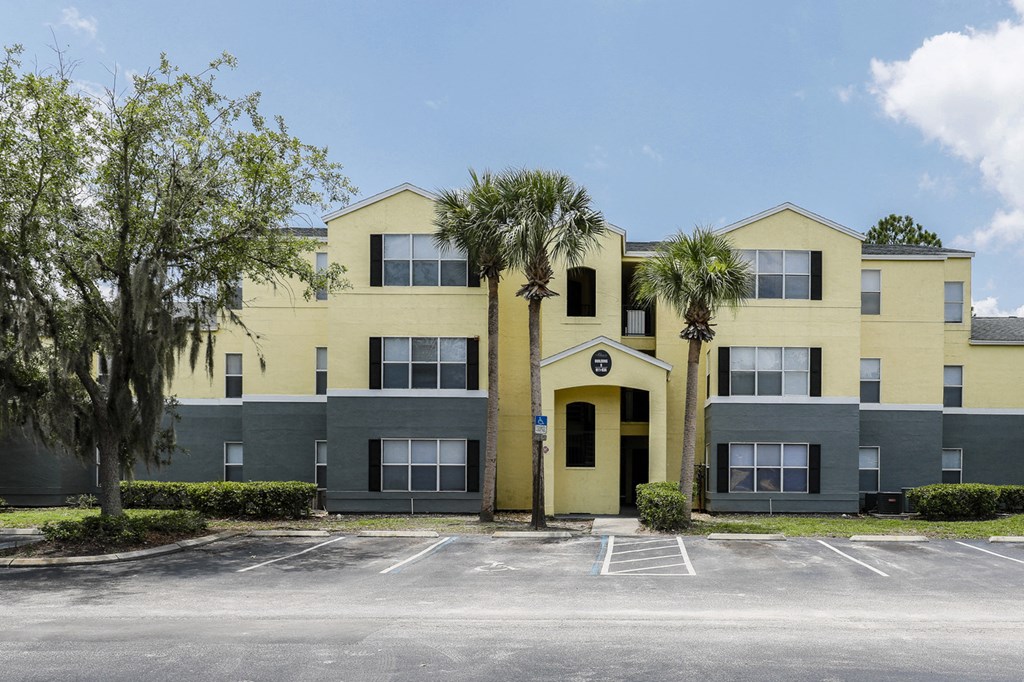 Building Exterior surrounded by shrubbery and trees
