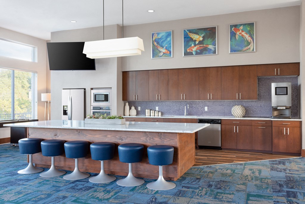 clubhouse kitchen with a large island and blue stools