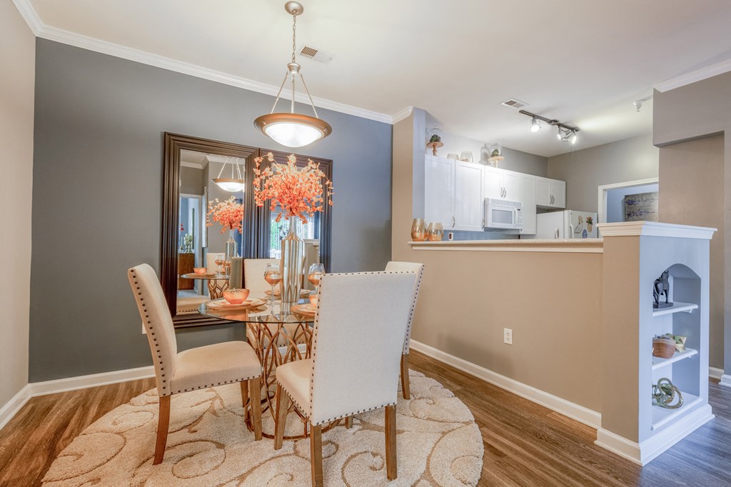 a dining room with a table and chairs