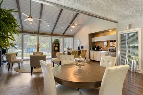 Clubhouse Lounge with Dining Table Chairs Coffee Tables and Leasing Desk with Chairs