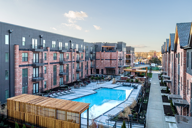 an aerial view of a large swimming pool in the middle of a building