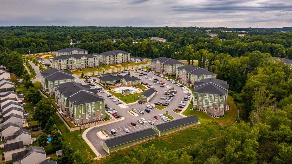 A large building complex surrounded by trees at Foxwood Apartments, Raleigh-Durham, NC
