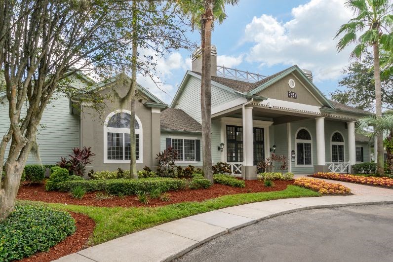 Leasing office exterior with native landscaping