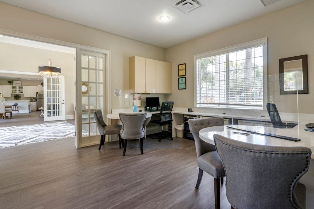 Clubhouse lounge and leasing center with large window for natural lighting