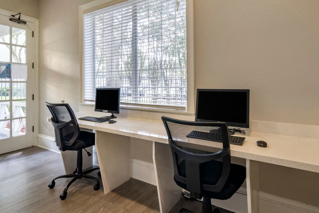 Resident business lounge with computers and chairs