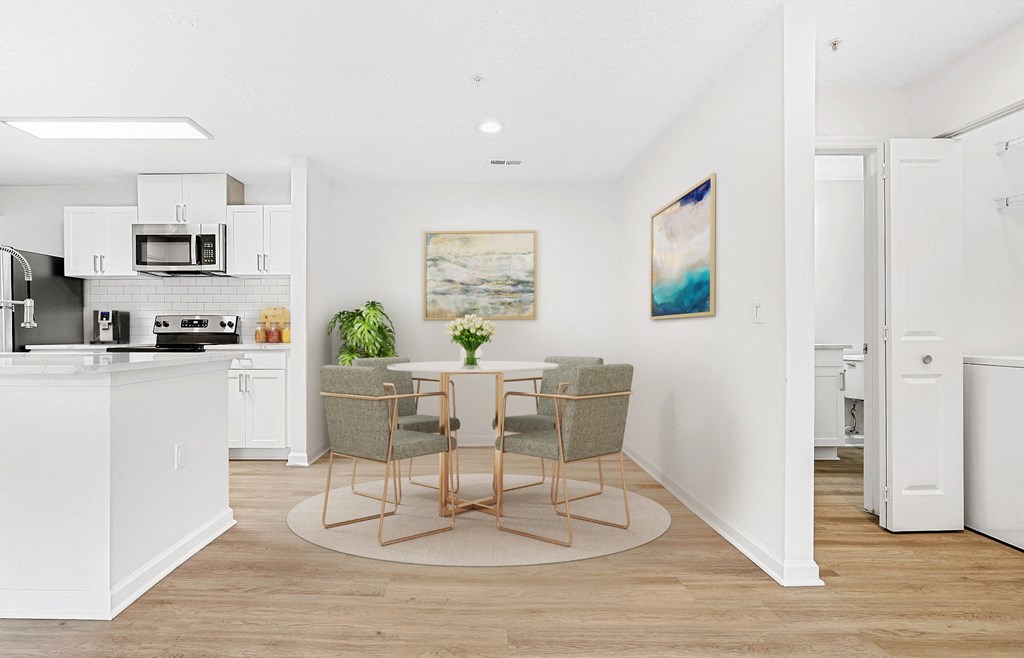 A kitchen with a dining table and chairs. at The Grayson Apartment Homes, Charlotte, NC, 28262