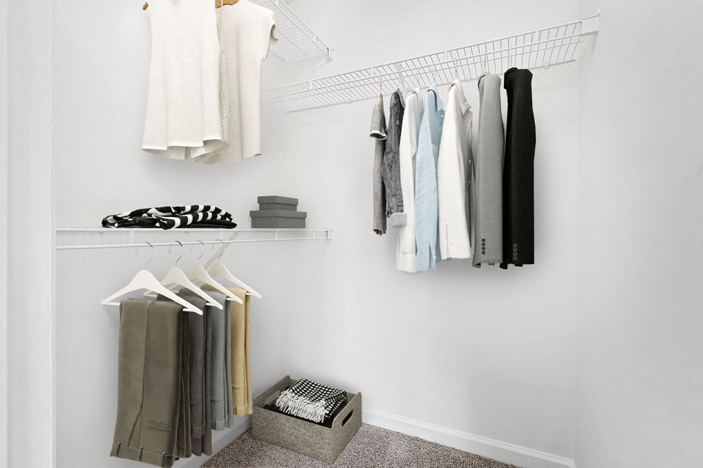 Closet With Clothes at The Grayson Apartment Homes, North Carolina
