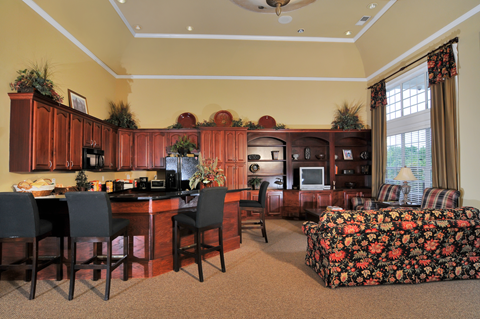 A kitchen with a dining table and chairs.
