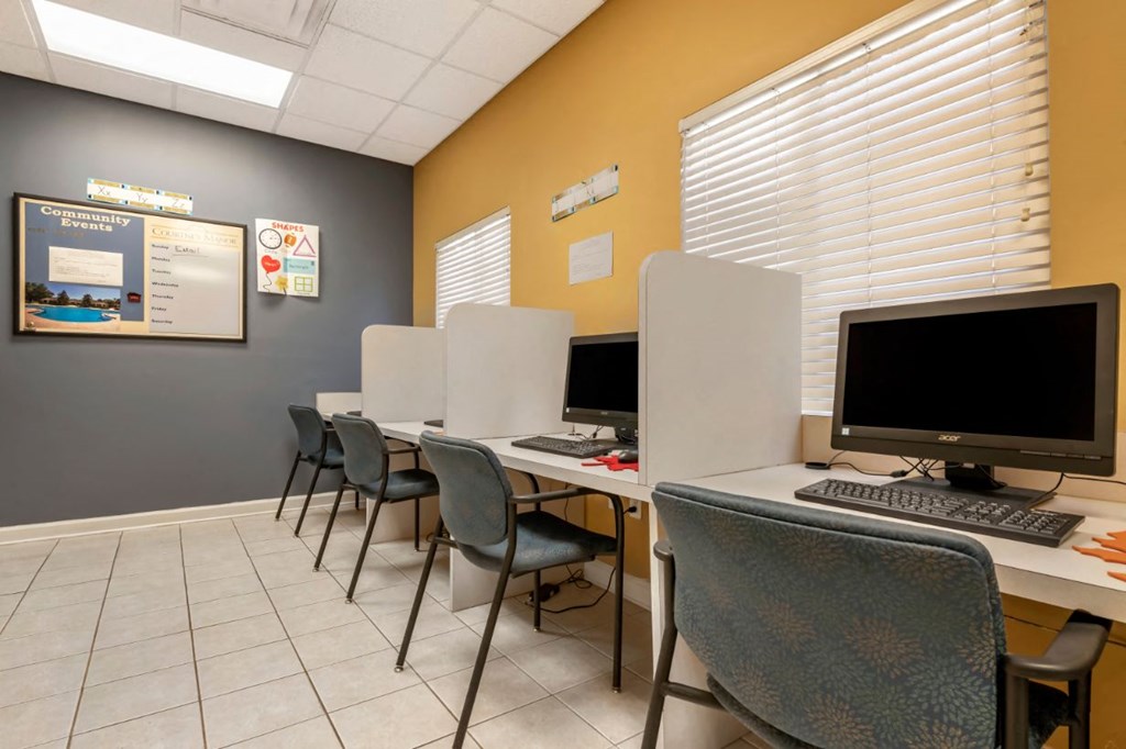 Resident business lounge with computers and chairs