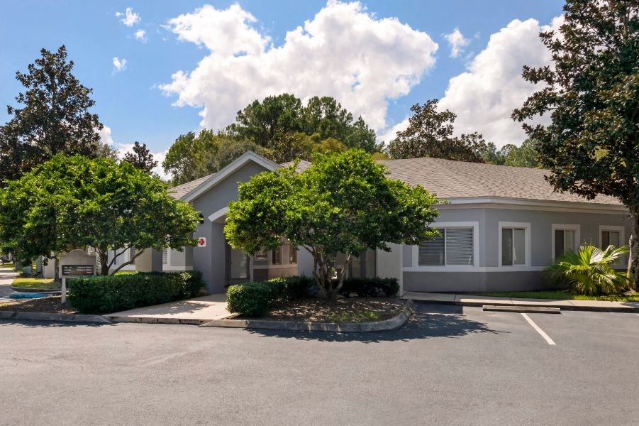 Leasing office exterior with native landscaping