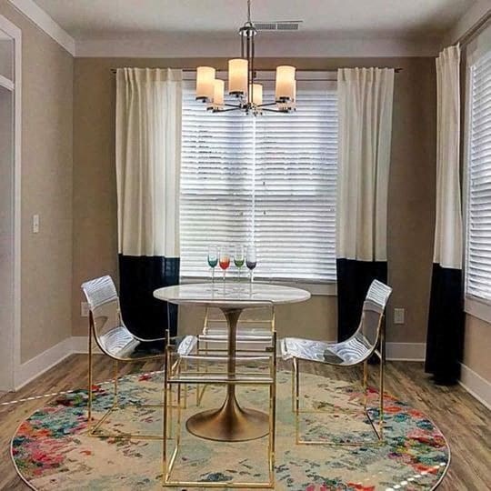 A dining room with a round table and chairs at Foxwood Apartments, Raleigh-Durham, NC