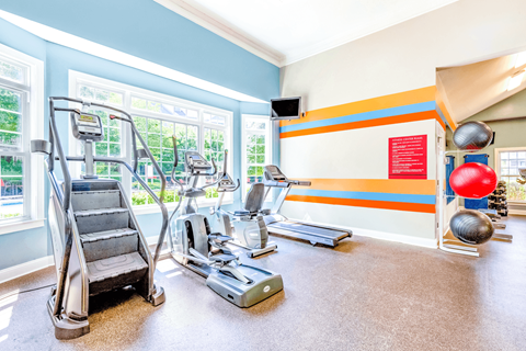a workout room with treadmills and other exercise equipment at Elan at Mallard Creek Apartment Homes, Charlotte, North Carolina