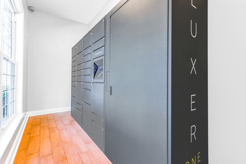 a row of lockers in a room with a large window at Elan at Mallard Creek Apartment Homes, Charlotte, NC
