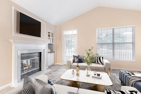 a living room with a fireplace and a tv above it at Elan at Mallard Creek Apartment Homes, Charlotte, North Carolina