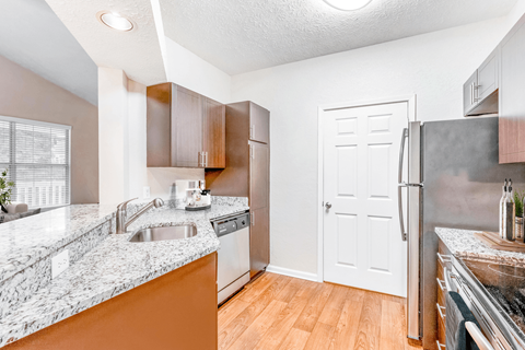 a kitchen with granite countertops and stainless steel appliances at Elan at Mallard Creek Apartment Homes, Charlotte, NC, 28269