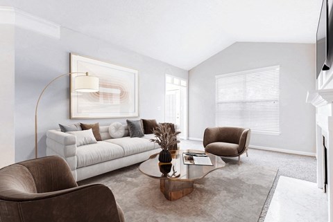 A living room with a white couch, a brown armchair, and a coffee table at Elan at Mallard Creek Apartment Homes, Charlotte, North Carolina