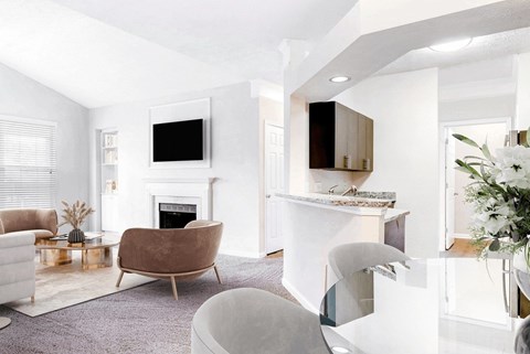 A modern living room with a fireplace and a television at Elan at Mallard Creek Apartment Homes, Charlotte, NC, 28269