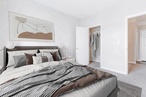 A bedroom with a large bed and a painting on the wall at Elan at Mallard Creek Apartment Homes, Charlotte, 28269