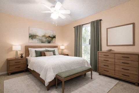 A bedroom with a bed, nightstands, and a painting on the wall.