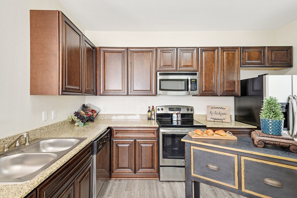 kitchen with brown cabinets and double-basin sink