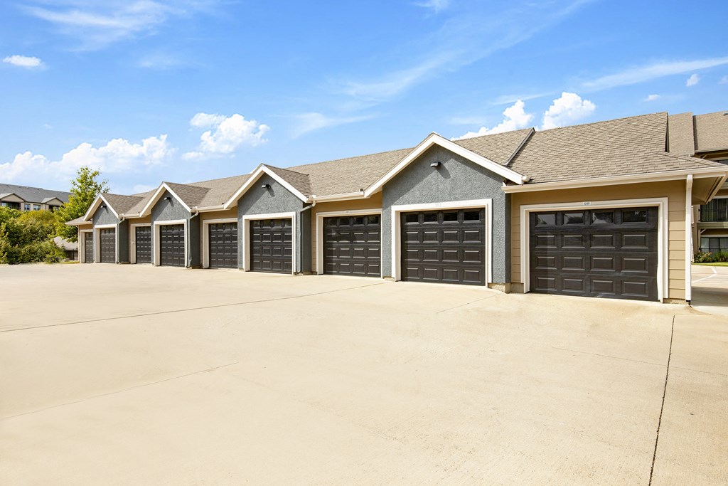 a row of garages in front of a house