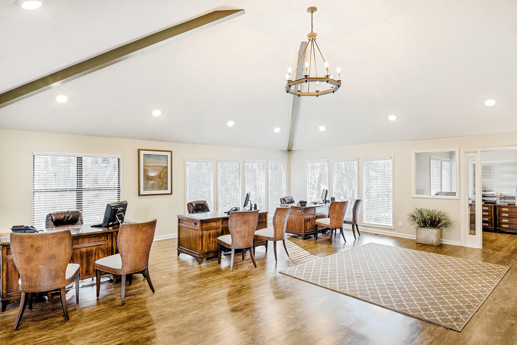 a dining room with a table and chairs and a chandelier
