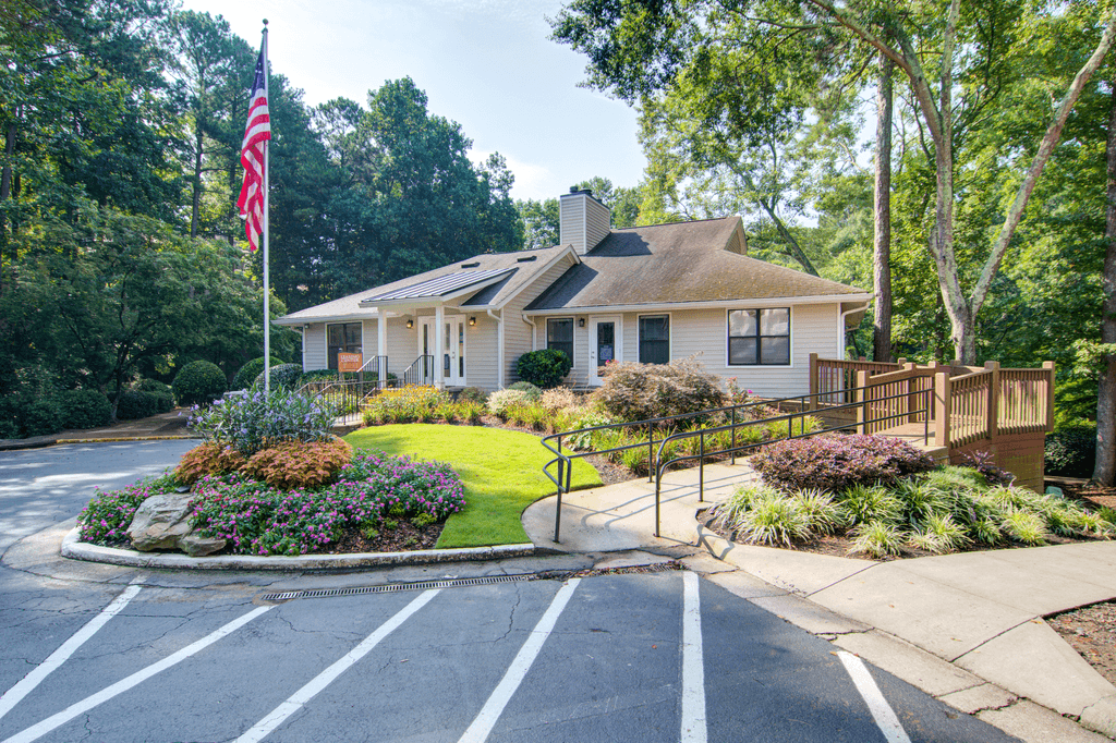 a small house with an flag on the front porch