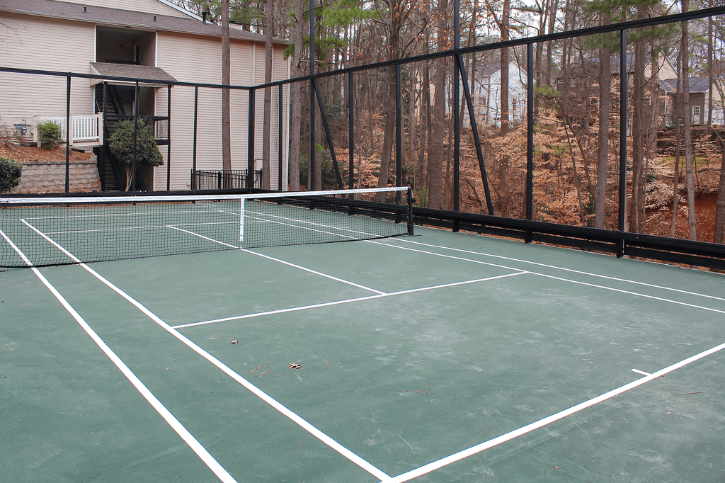 our tennis court is in front of our house and has a fence around it