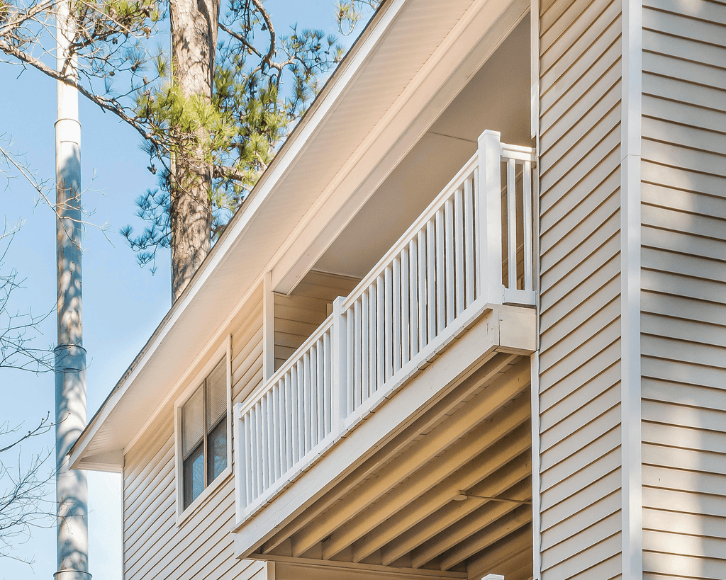 a balcony on the side of a house