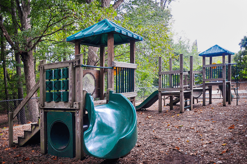 a playground with a slide and other play equipment