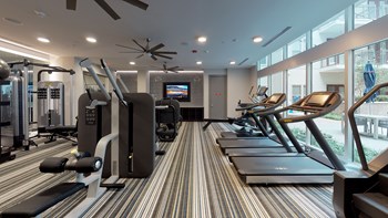Fitness center area facing treadmills, weights, and other workout equipment. - Photo Gallery 95