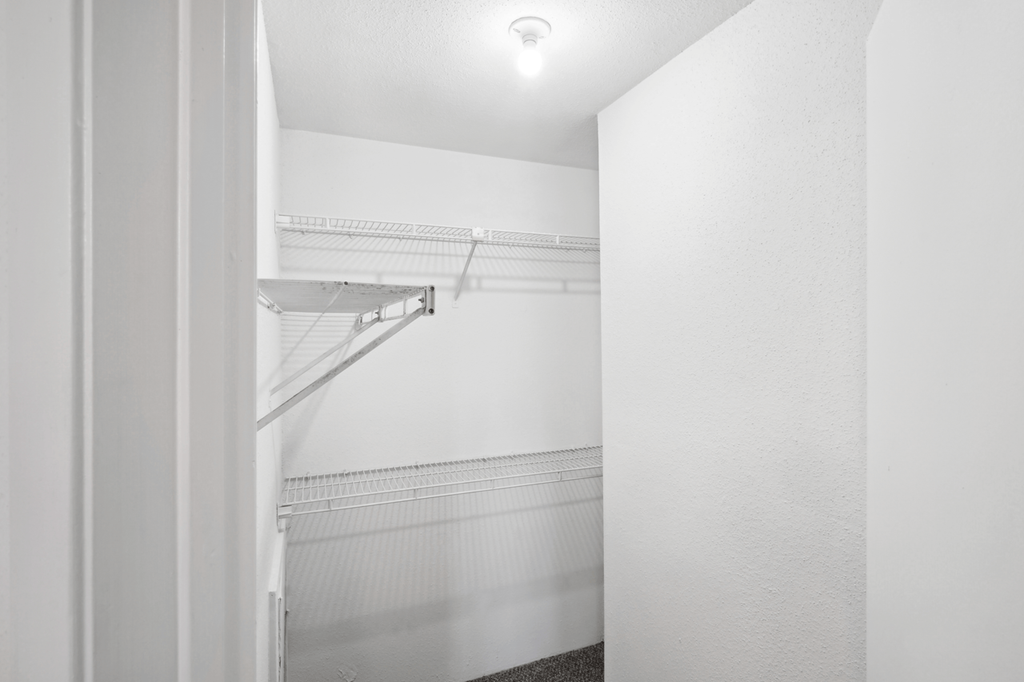 a walk in closet in a 555 waverly unit