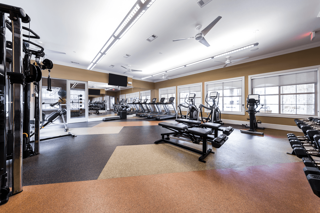 the gym at the enclave at woodbridge apartments in sugar land, tx