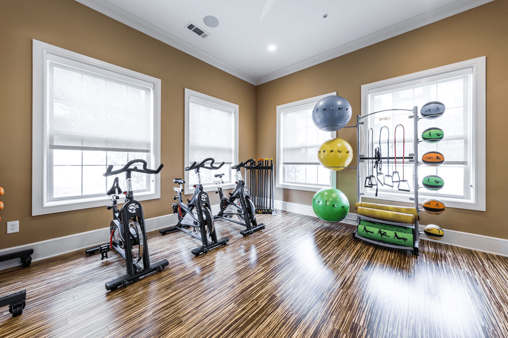 the gym at the enclave at woodbridge apartments in sugar land, tx