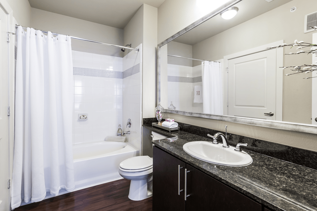 a bathroom with a sink toilet and bathtub
