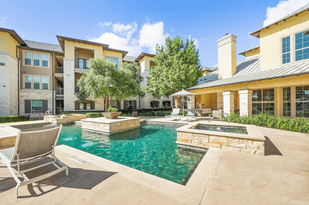 the preserve at ballantyne commons community swimming pool and hot tub with lounge chairs