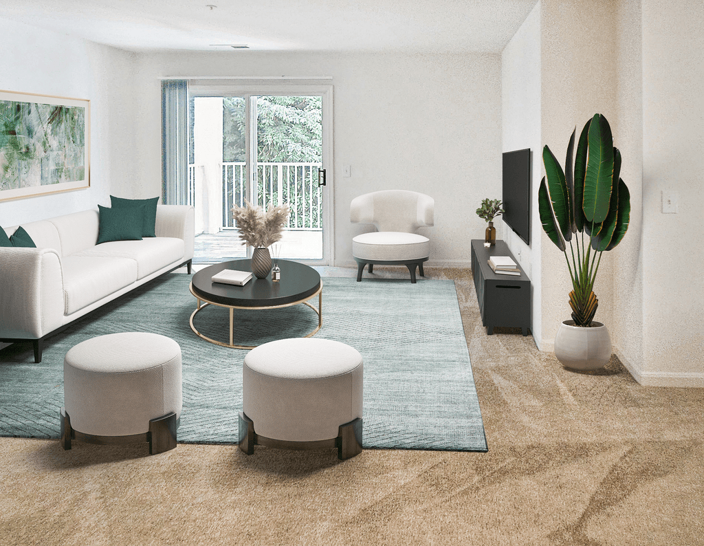 Living room with tan carpet and white walls with the patio door on the back wall. Virtually staged with a couch, decorative chair, two small ottomans, a coffee table, wall aret behind the couch, an accent rug, standing potted plant and a television on an entertainment stand.