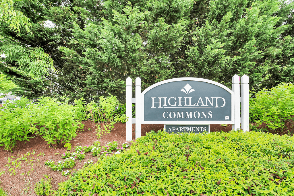 Monument sign surrounded by native landscape