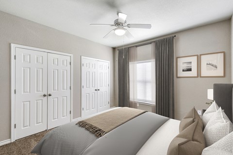 a bedroom with a ceiling fan and a window