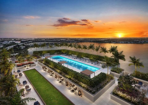 a rendering of a pool at sunset overlooking the city
