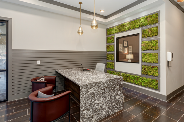 a conference room with a table and two chairs