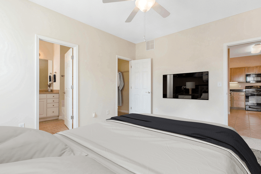 staged bedroom with carpeted flooring and ceiling fan at Ashley Court Apartments, North Carolina, 28262
