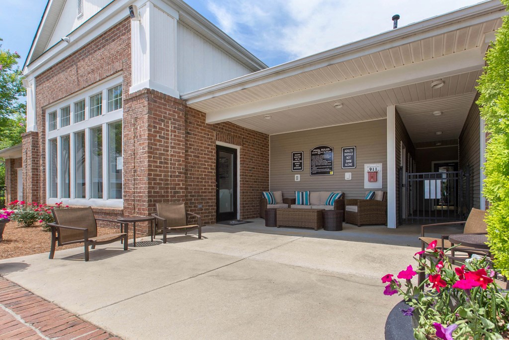 Clubhouse Exterior with Lounge with Patio Furniture at The Grayson Apartment Homes, North Carolina, 28262