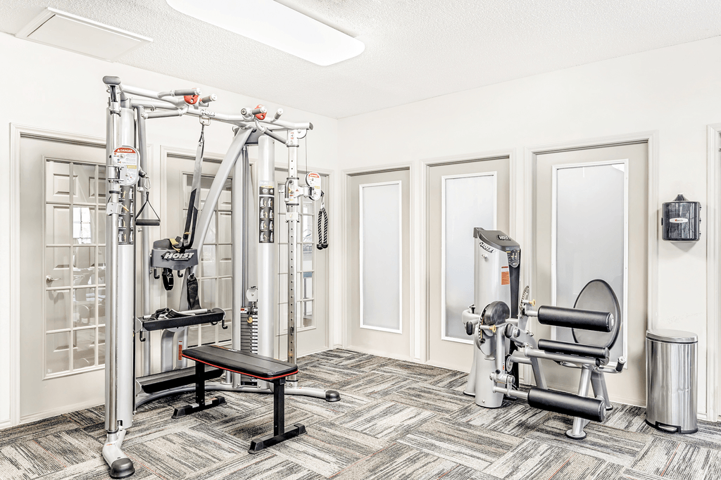 Fitness center with strength machines and frosted glass windows