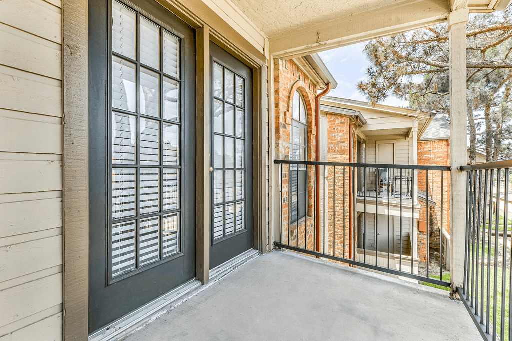 Covered balcony with metal banister